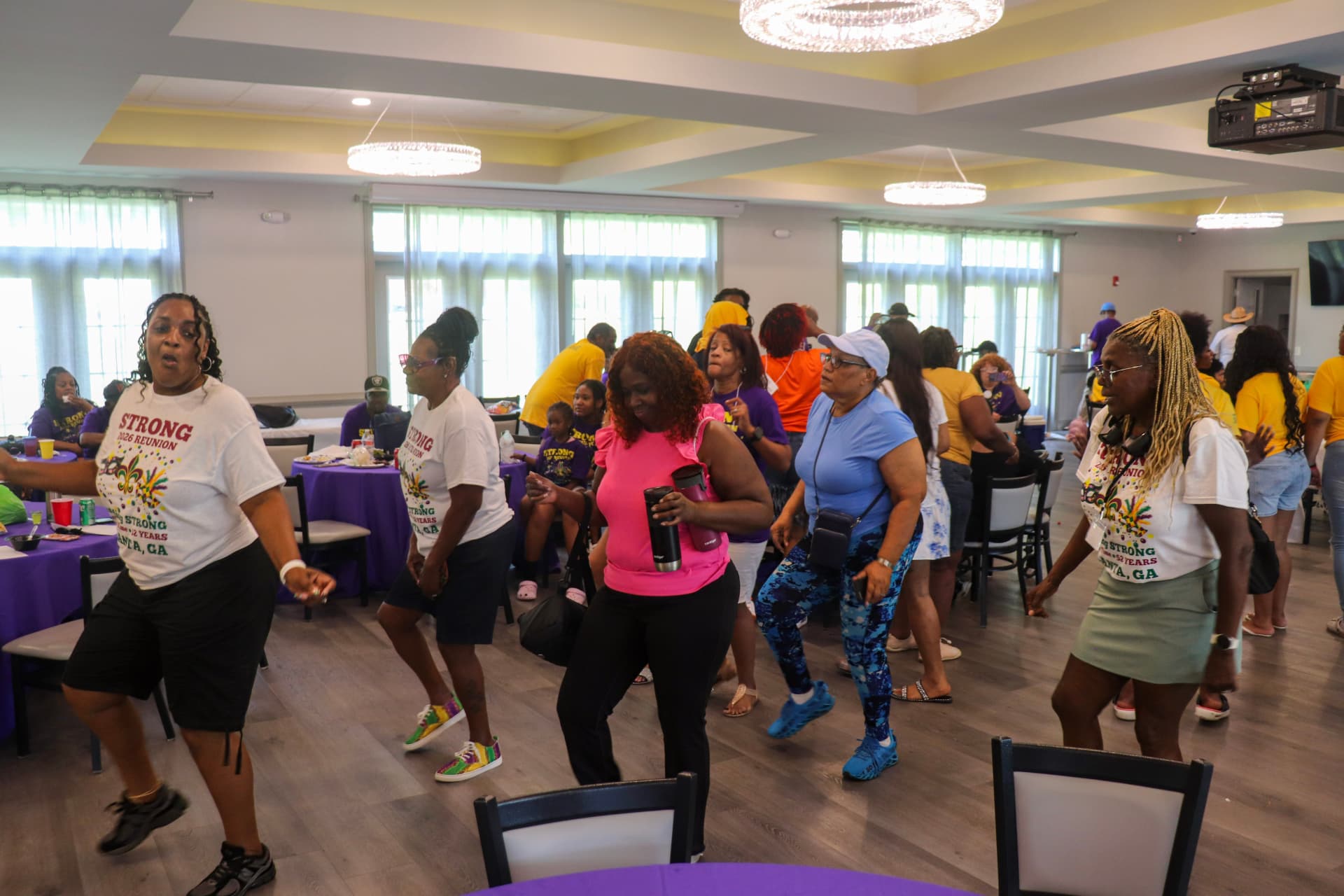 Family line dancing at the reunion hall