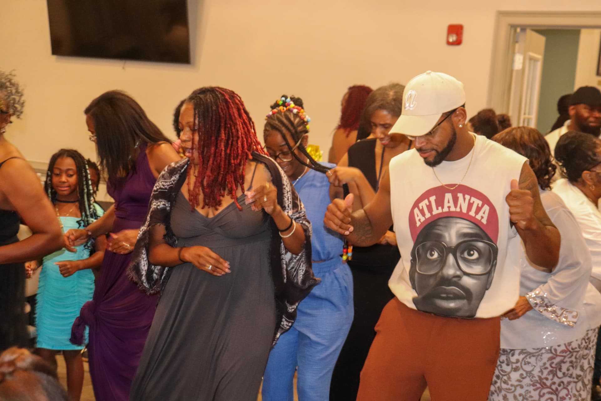 Family soul-train line on the dance floor